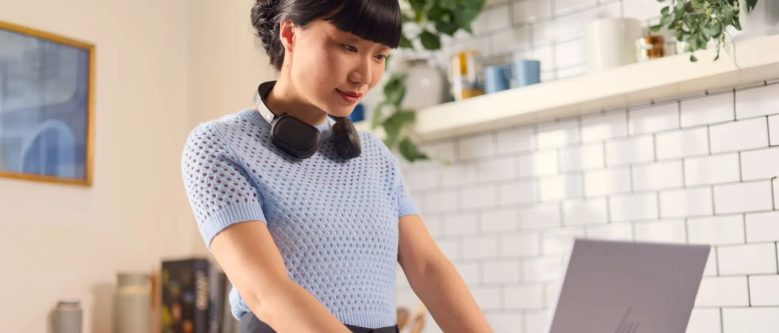 Professional using an HP Poly headset at work