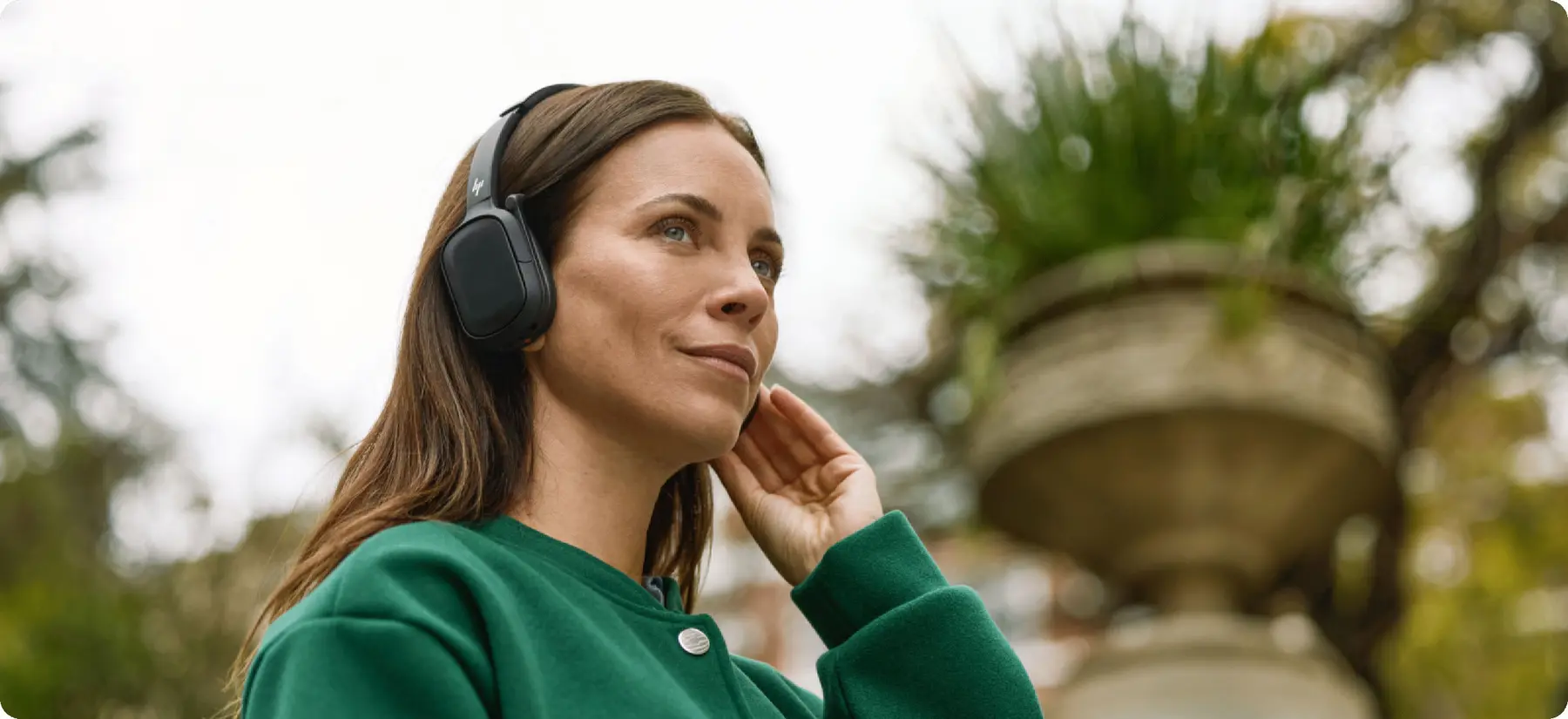 Professional using an HP Poly Focus 6 headset in a flexible workspace